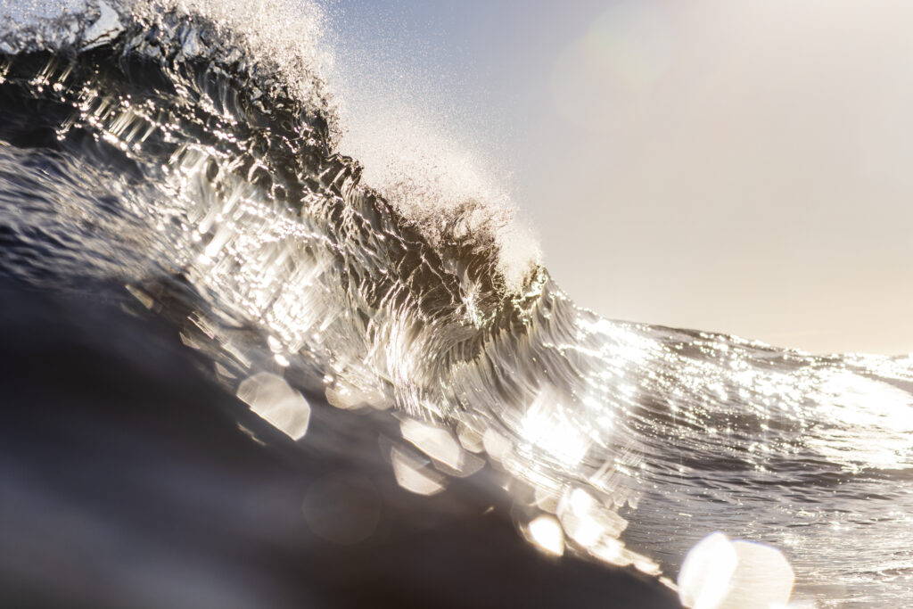 ocean wave with sunlight